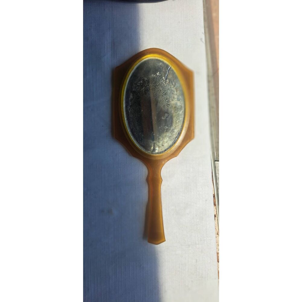 Vintage early plastic/celluloid-style vanity mirror, likely dating from the earl